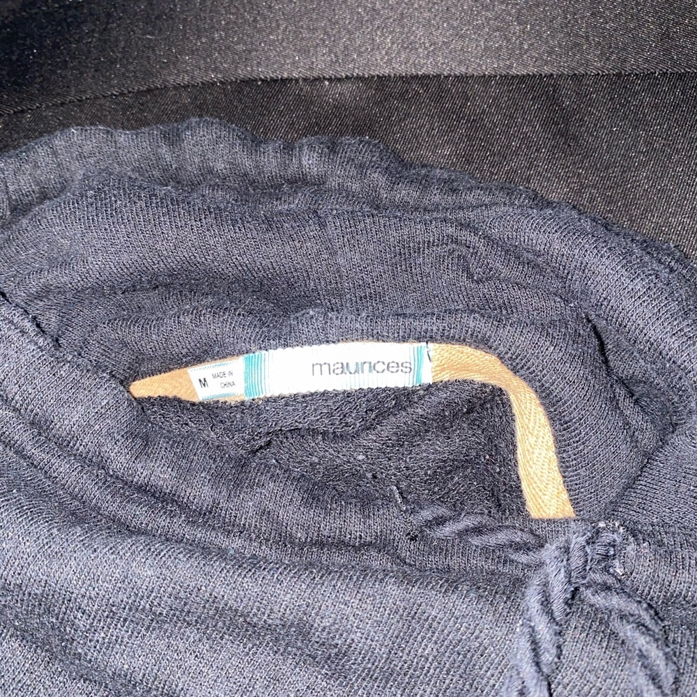 A black long turtle neck sweater